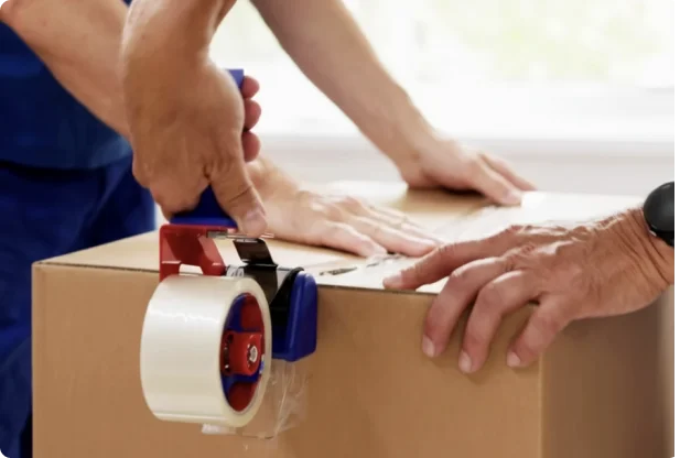 Packing a cardboard box securely with tape