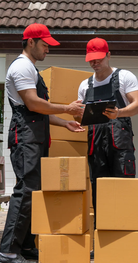 Professional movers managing inventory during a move
