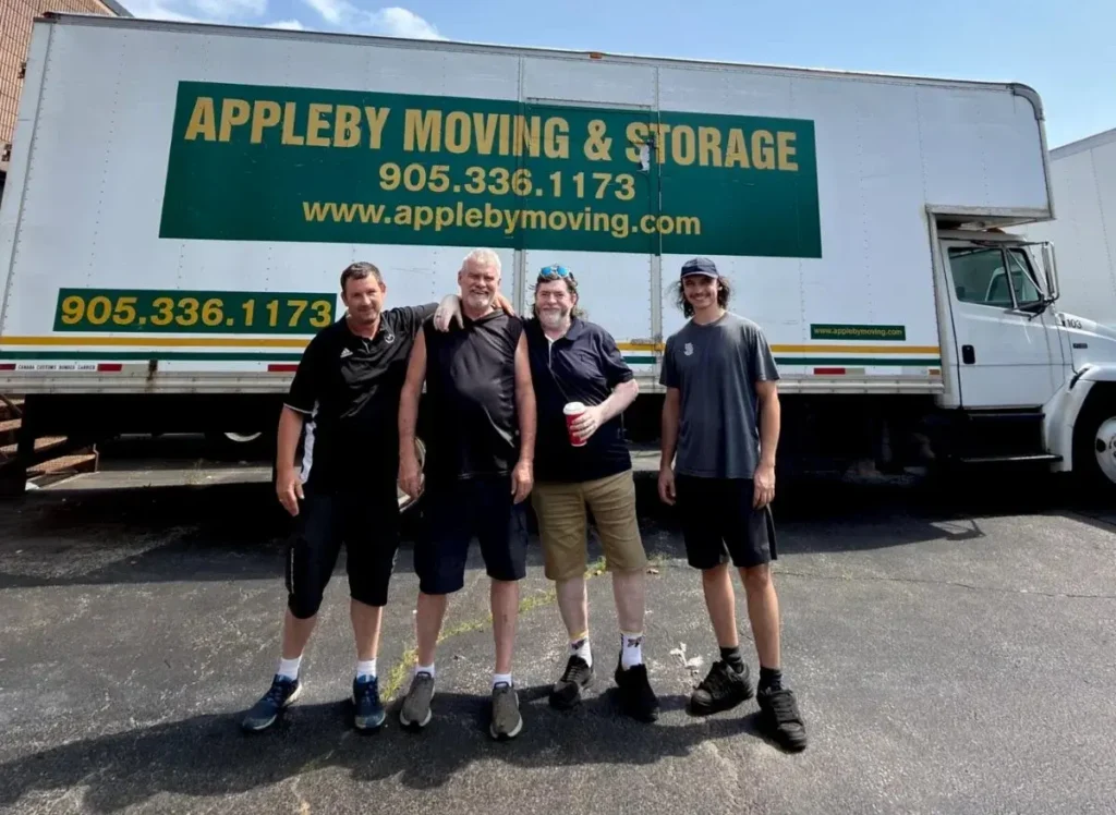 The Appleby Moving & Storage crew in front of their truck at the Burlington yard